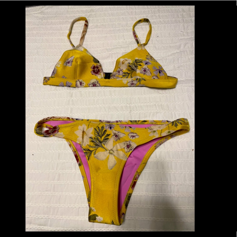 Triangl. Size small top and size medium bottom.